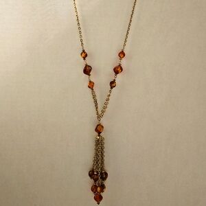 Long fashion necklace gold tone brown beads